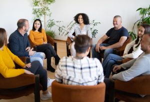 People joining an support group for families of people with disability.